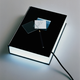 Illustration for article titled Multibook is a Lamp, Charger and Alarm Clock, Disguised As an Ordinary Book